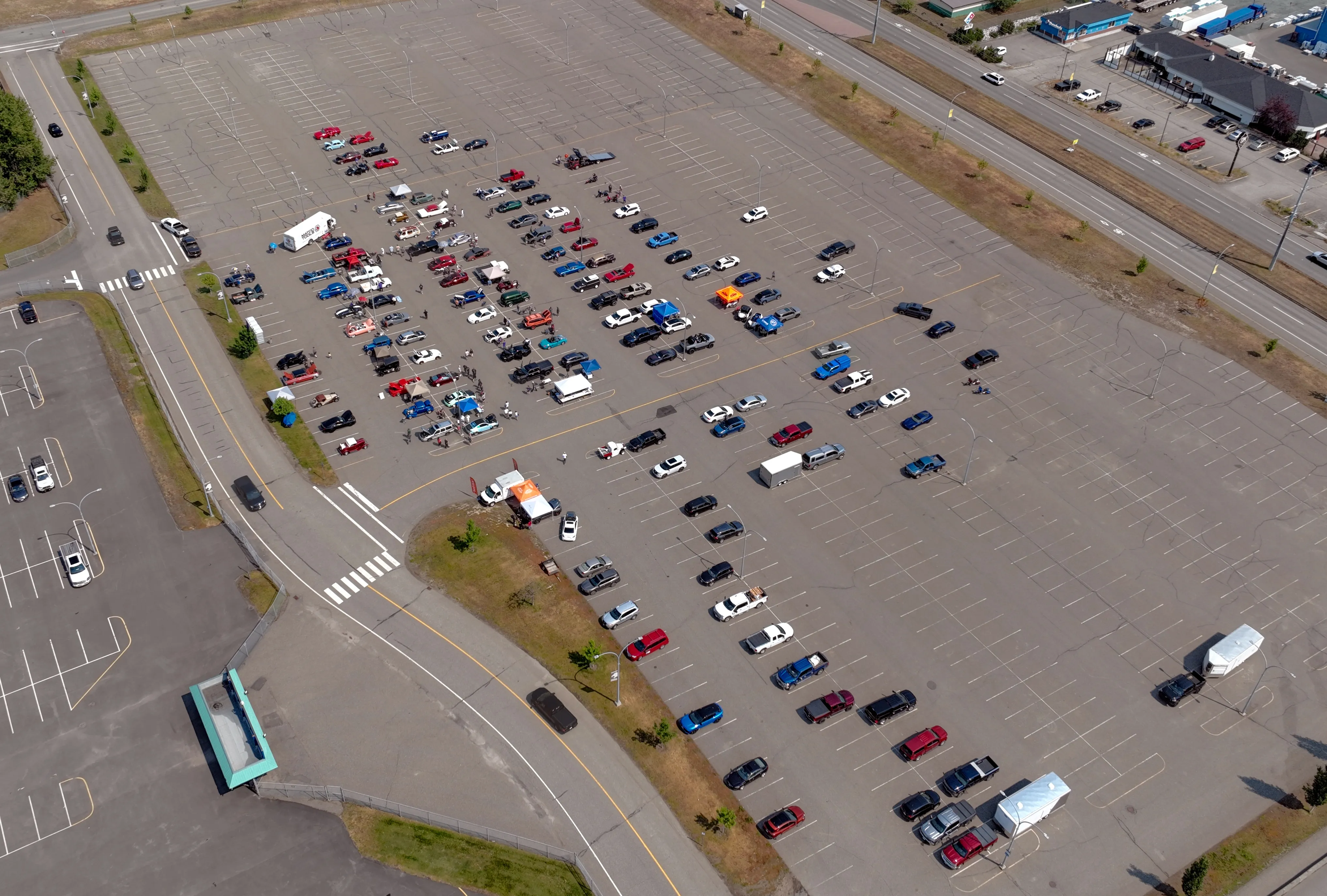 Aerial overview of a local auto show — hero